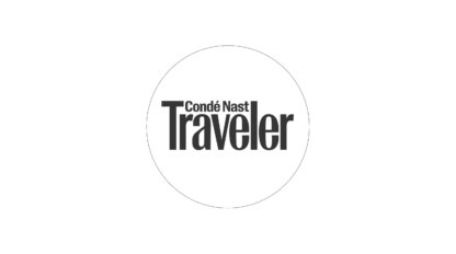 Black "Condé Nast Traveler" logo inside a circle on a white background, showcasing the world of top travel specialists.